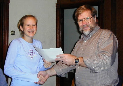 Brittany receives her diploma from Roger Luce